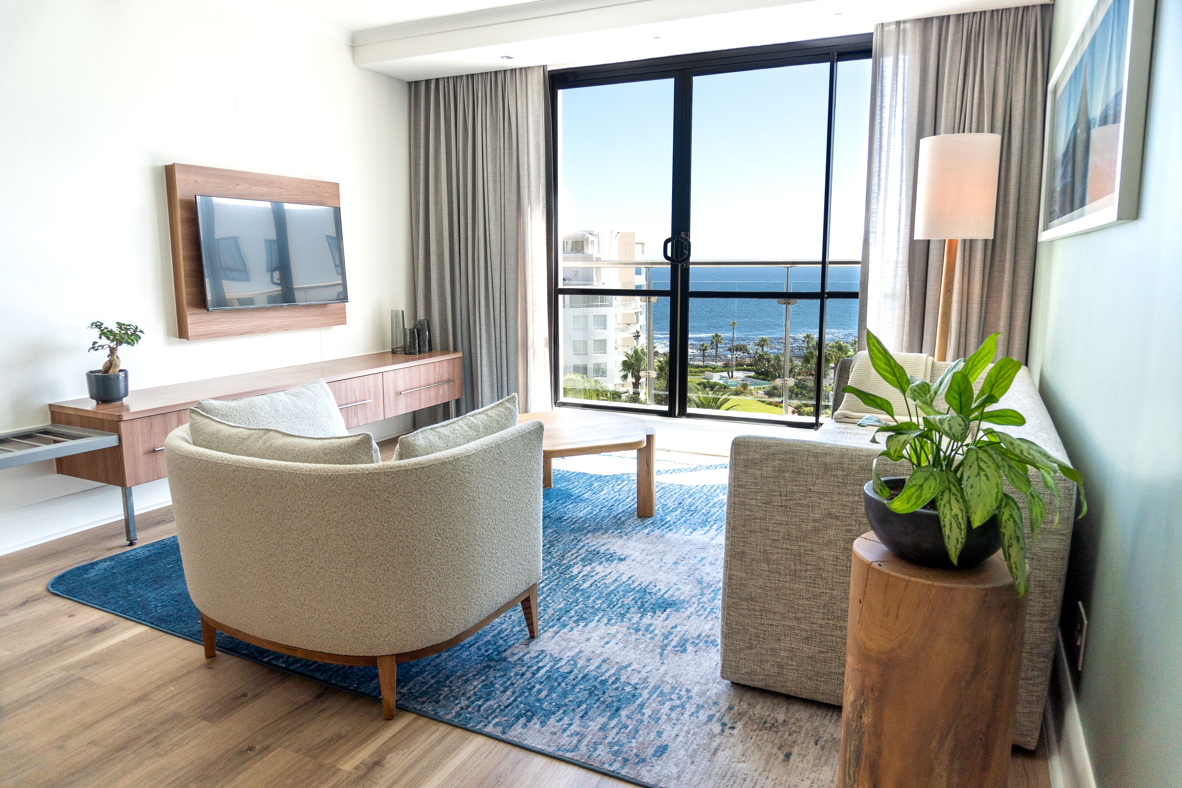 Signature Ocean Suite with Balcony | Living area | Flat-screen TV