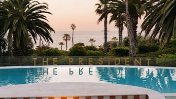 Outdoor pool, pool umbrellas, sun loungers