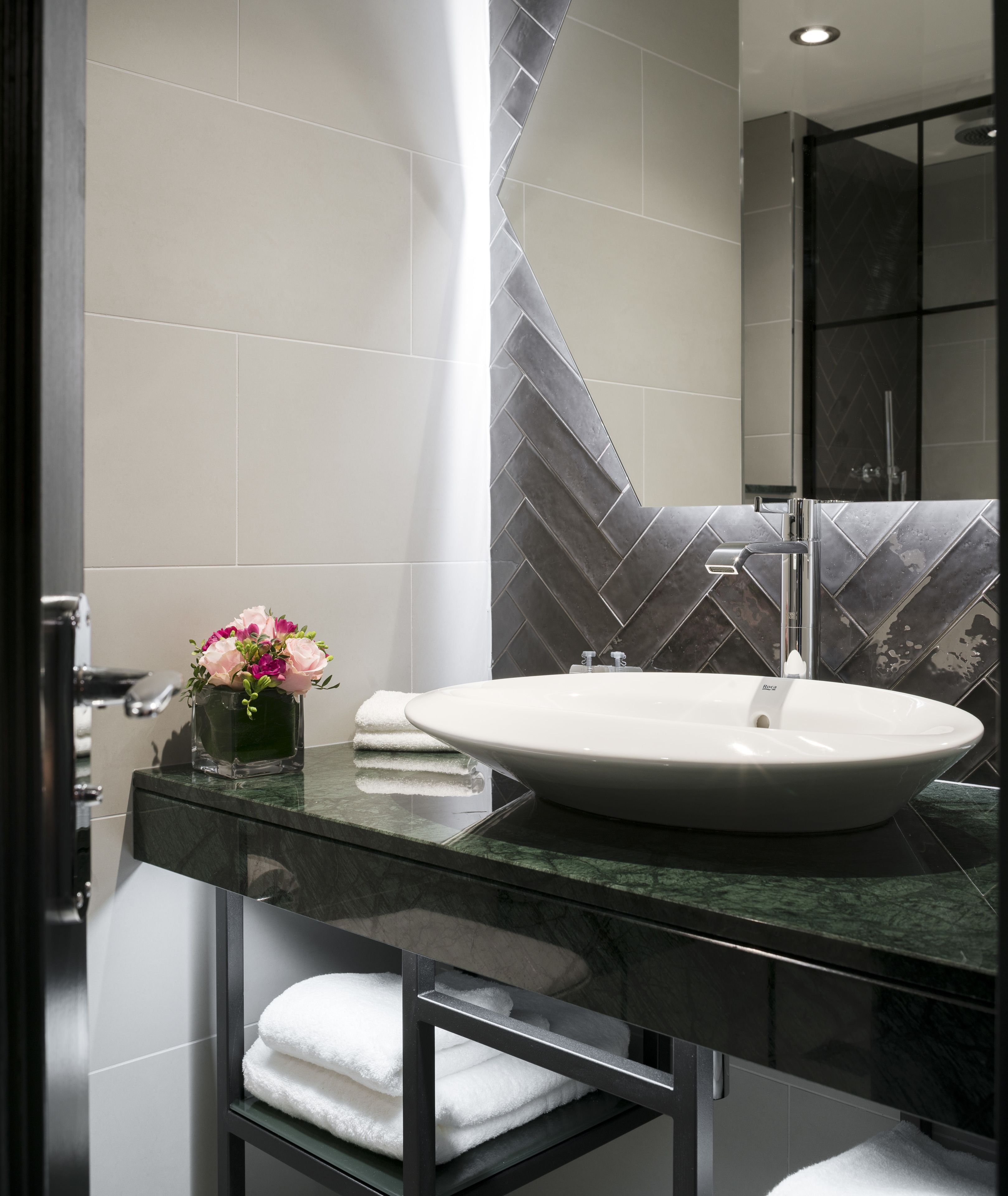 designer toiletries, hair dryer, towels