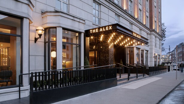 A building with a marquee sign reading "THE ALEX" and a well-lit entrance. - The Alex (Dublin)
