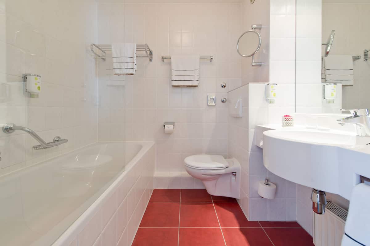 eco-friendly toiletries, hair dryer, slippers, towels