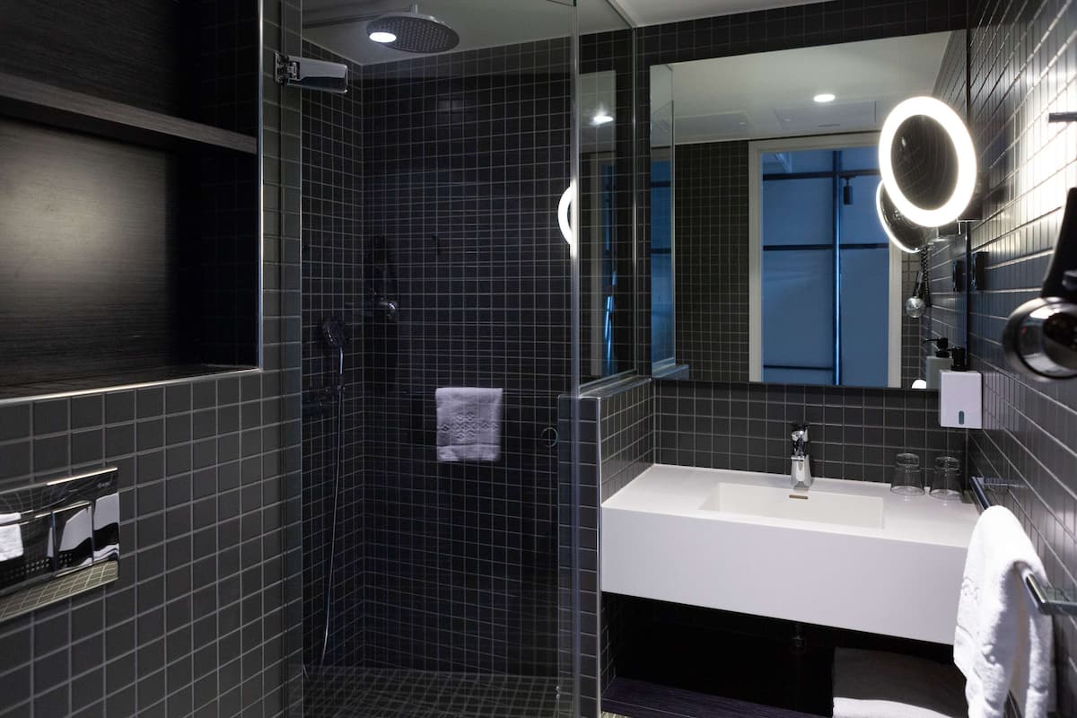 superior double room | bathroom | hair dryer, towels