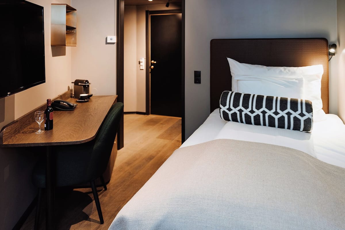Premium bedding, minibar, blackout curtains, iron/ironing board