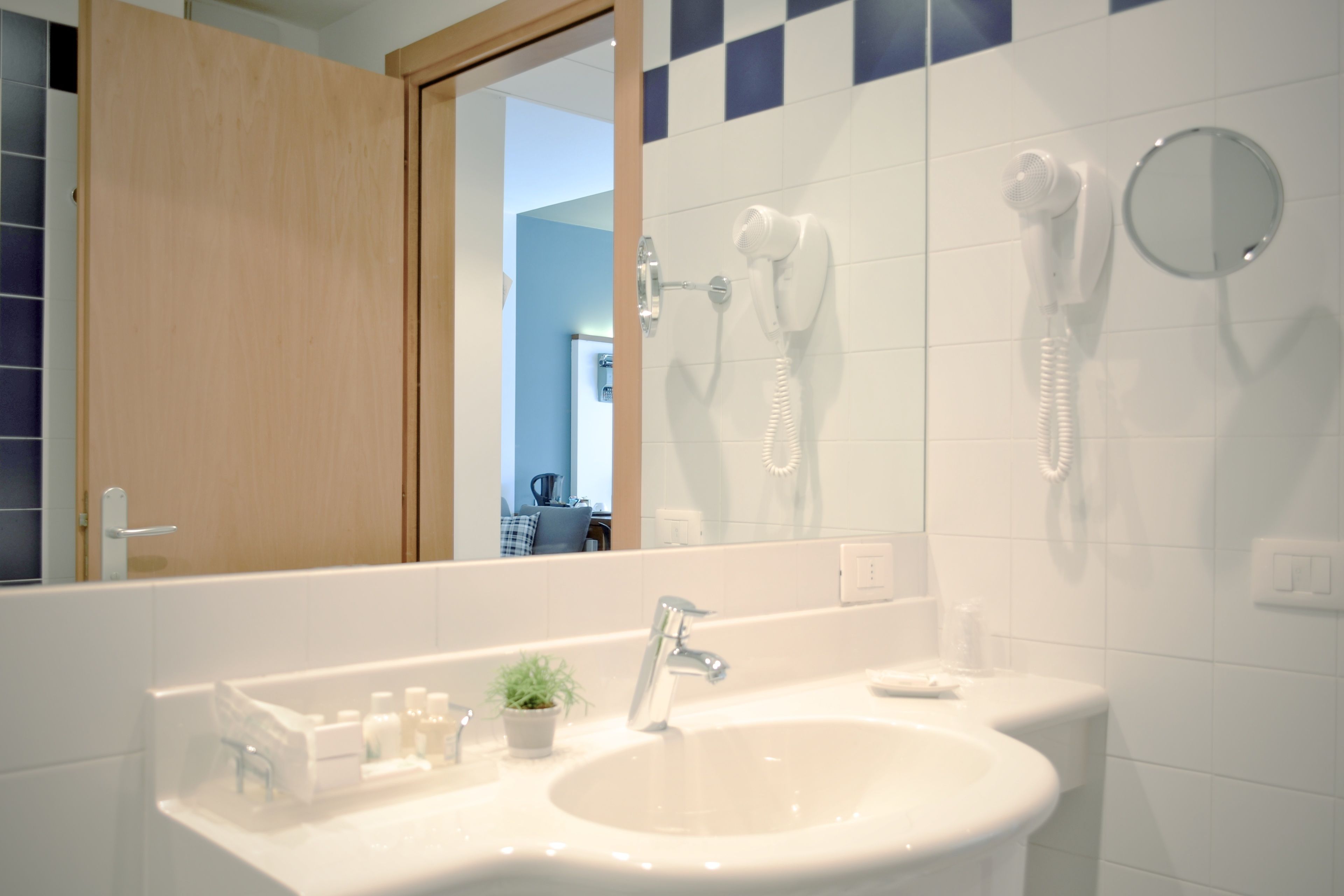 quadruple room | bathroom | shower, free toiletries, hair dryer, slippers