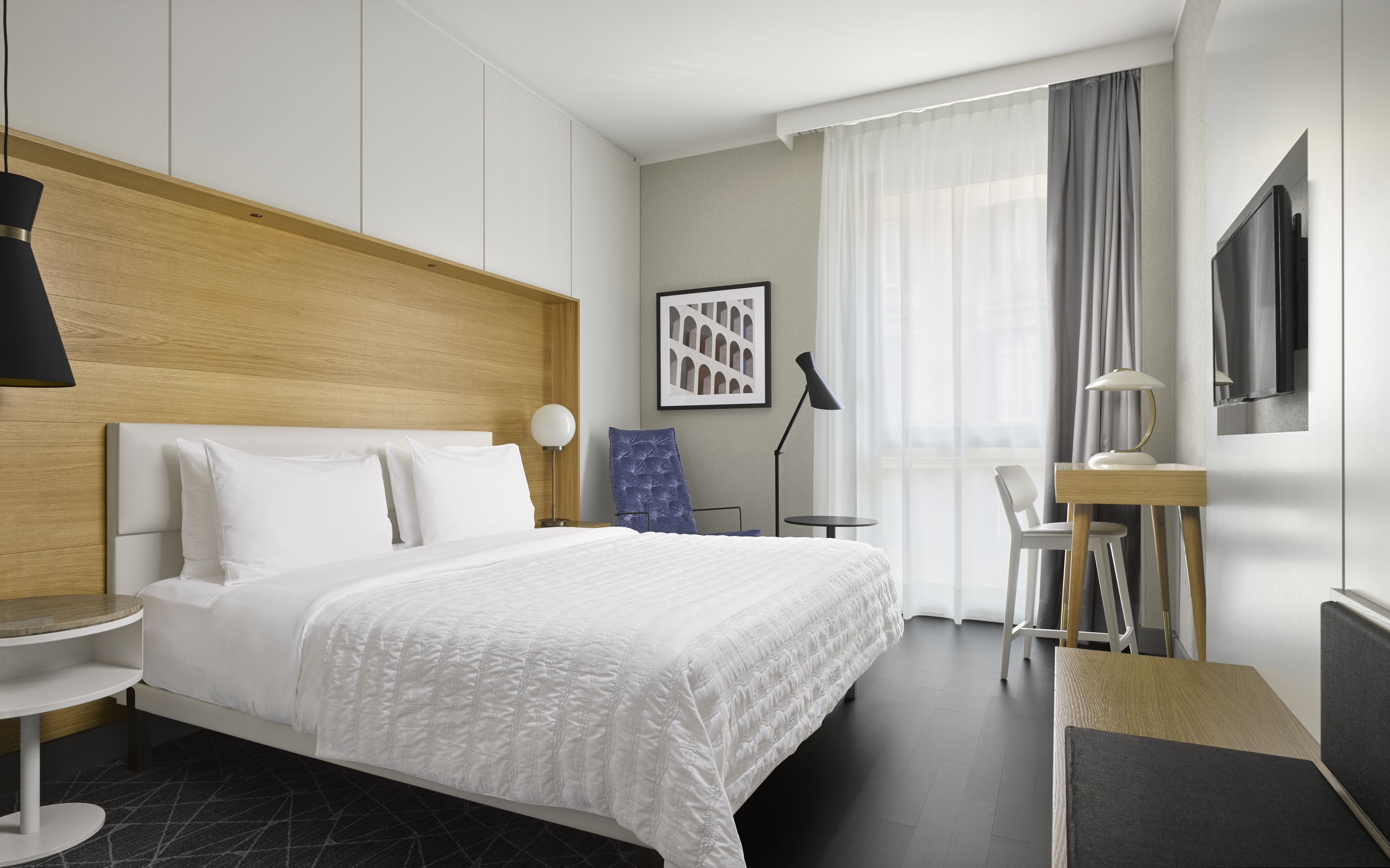 Hypo-allergenic bedding, free minibar items, in-room safe, desk