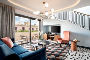 Suite Signature, 1 chambre, vue sur la ville | Aire de séjour | Téléviseur ACL