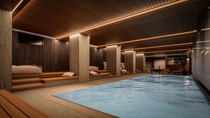 A spa area with a pool, benches, and massage chairs. - Bergstadens Hotel & SPA (Roros)