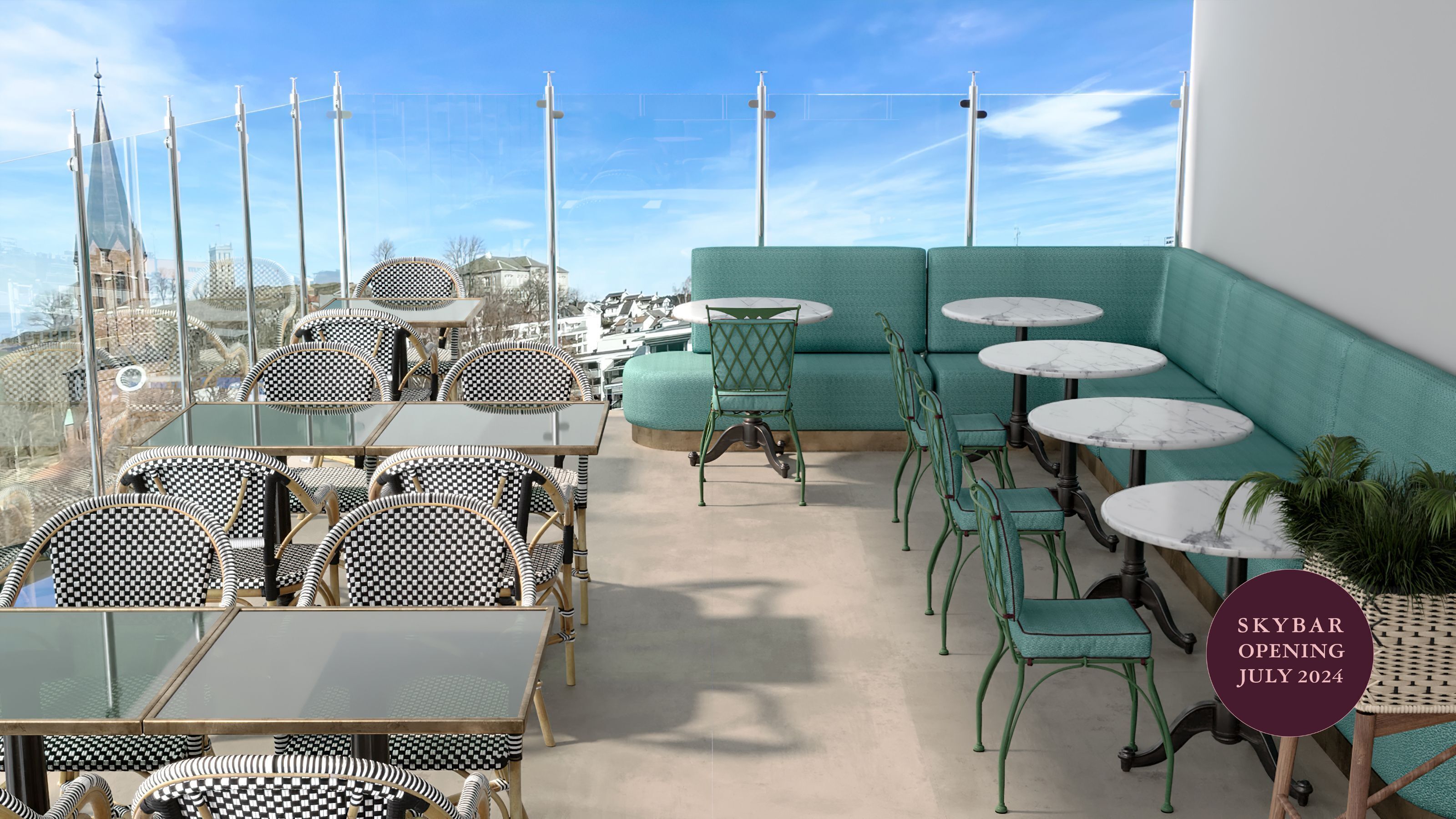 A rooftop terrace with checkered chairs and tables, a teal sofa, and a view of the city skyline.