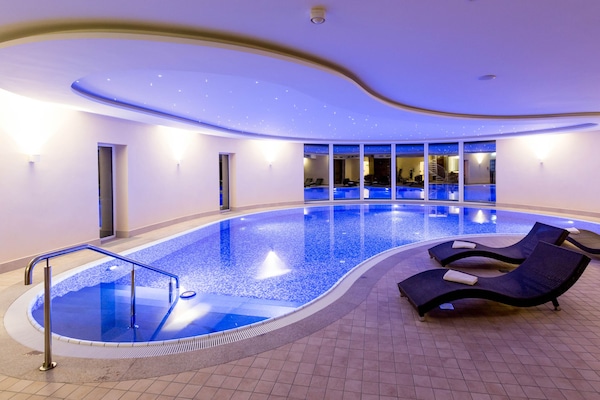 Indoor pool, open 6:00 AM to 10:00 PM, sun loungers
