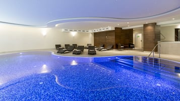 Indoor pool, open 6:00 AM to 10:00 PM, pool loungers