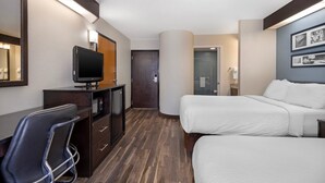 A hotel room with a desk, TV, two beds, and a mirror. - Sleep Inn Garner - Clayton (Garner)