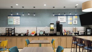A modern cafe with wooden tables and chairs, a coffee machine, and a menu board. - Garner Hotel Aiken South by IHG (Aiken)