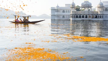 Experience a tranquil boat ride amidst a stunning palace with breathtaking views.