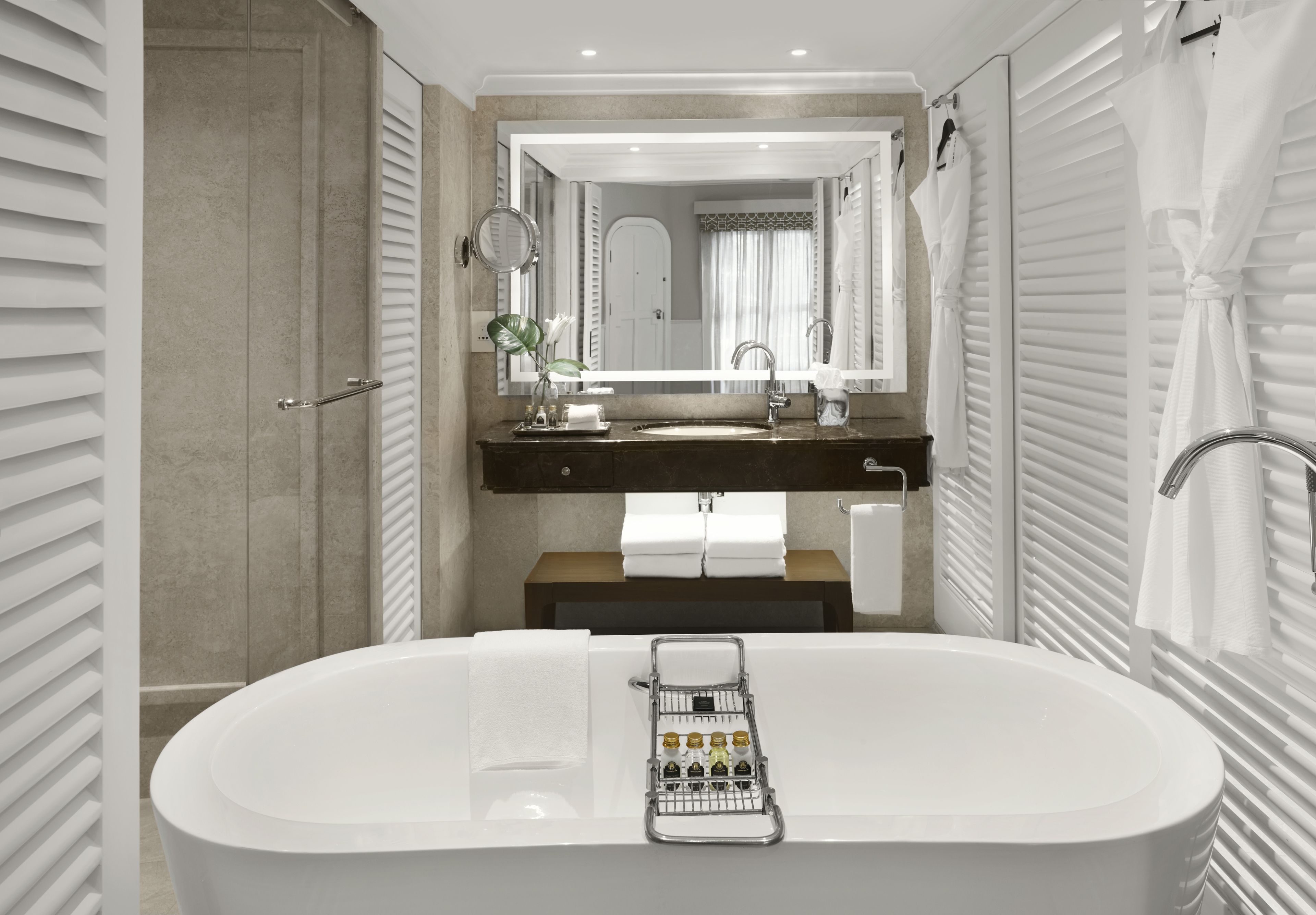 designer toiletries, hair dryer, bathrobes, slippers