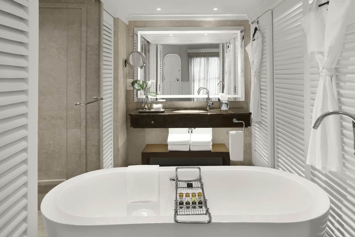 designer toiletries, hair dryer, bathrobes, slippers