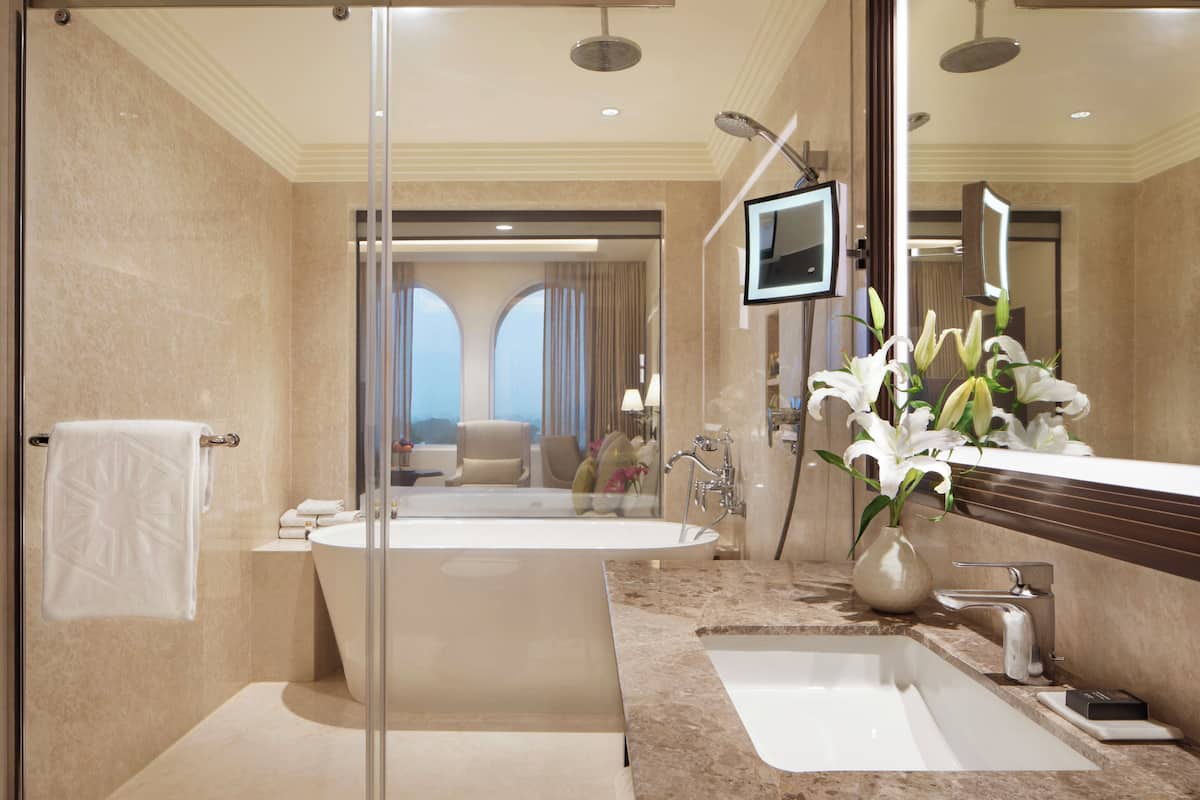 luxury room, 1 king bed, city view | bathroom | designer toiletries, hair dryer, bathrobes, slippers