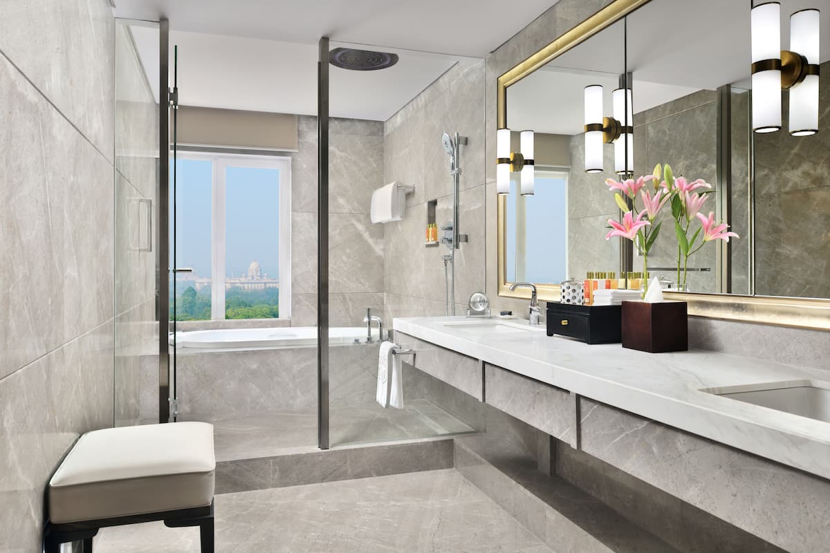taj club, club suite | bathroom | combined shower/bathtub, deep-soaking bathtub, free toiletries