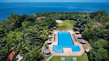 Outdoor pool, pool umbrellas, lifeguards on site