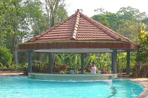 Outdoor pool, open 6:00 AM to 8:00 PM, pool umbrellas, pool loungers