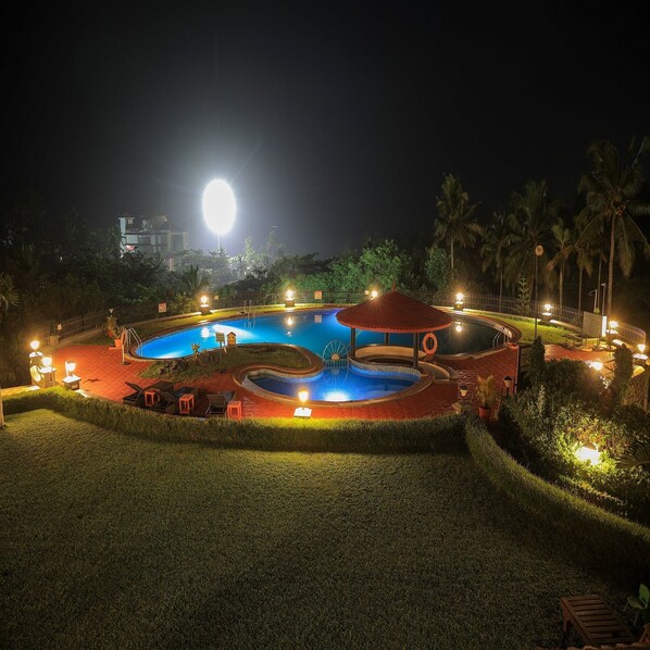 Outdoor pool, open 6:00 AM to 8:00 PM, pool umbrellas, pool loungers