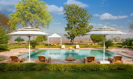 Outdoor pool, open 7:00 AM to 6:00 PM, pool umbrellas, sun loungers