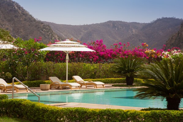 Outdoor pool, open 7:00 AM to 6:00 PM, pool umbrellas, pool loungers