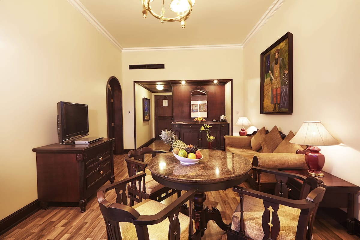 Executive Suite, 1 Bedroom | Living area | TV