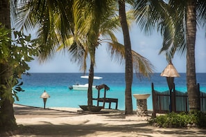 Private beach, white sand, free beach cabanas, sun-loungers