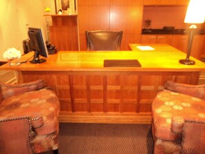 Welcome to our reception area, where guests can check in and relax in comfortable seating.