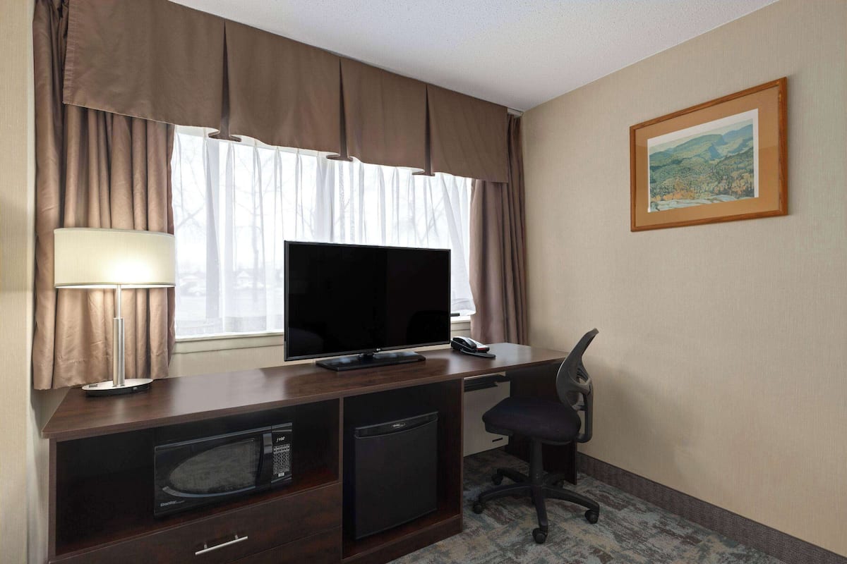 in-room safe, desk, blackout curtains, iron/ironing board