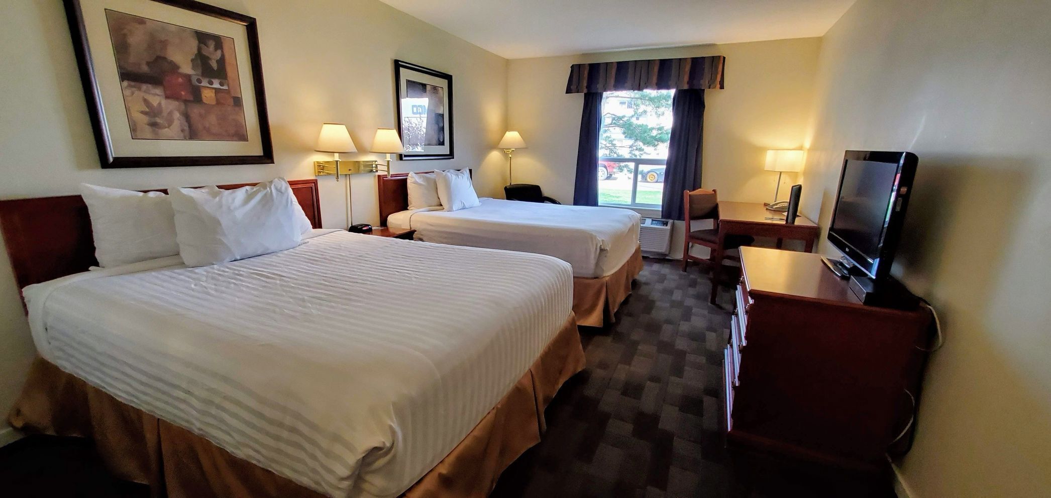 Desk, iron/ironing board, free cribs/infant beds, rollaway beds