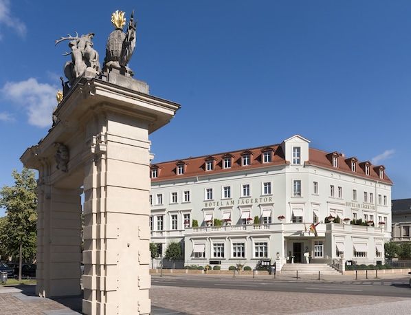 A historic building with a classical facade, large windows, and a prominent entrance.