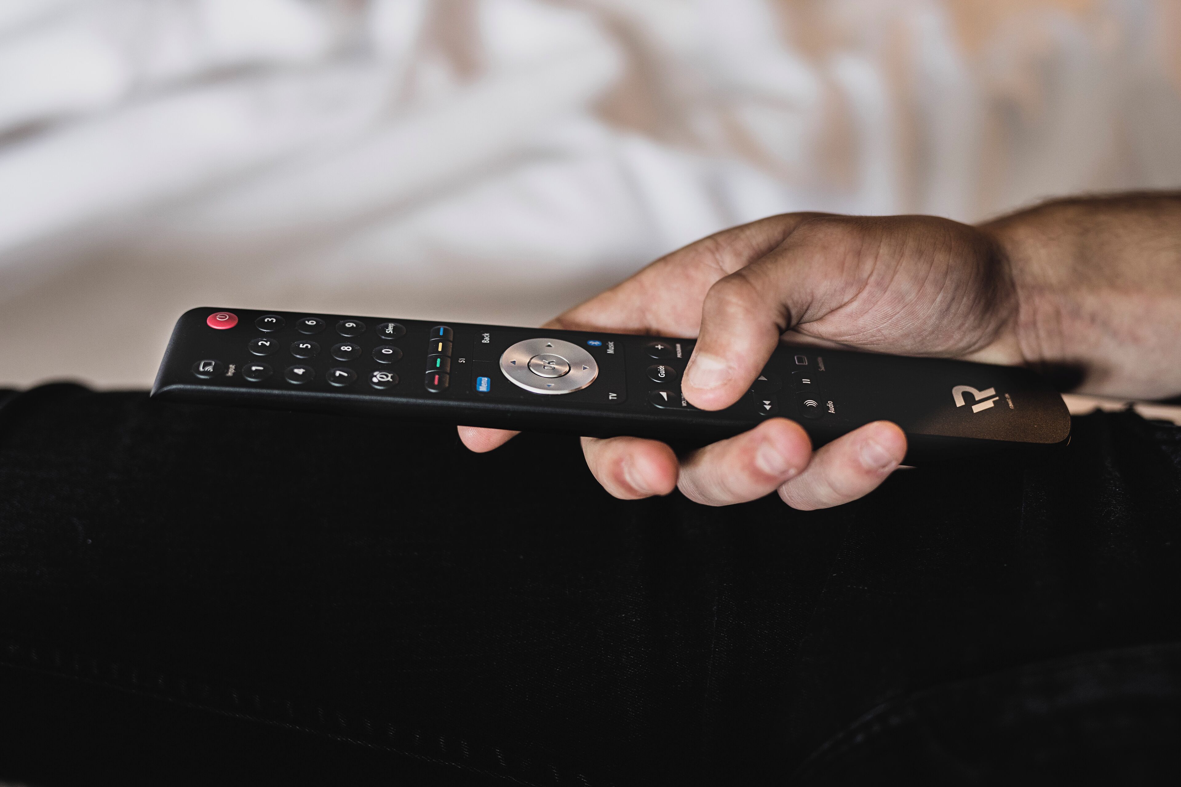 A person holding a remote control.