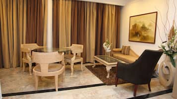 Suite, 1 Bedroom | Living room | LCD TV