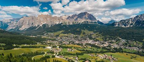 A mountainous landscape with a town nestled in the valley.