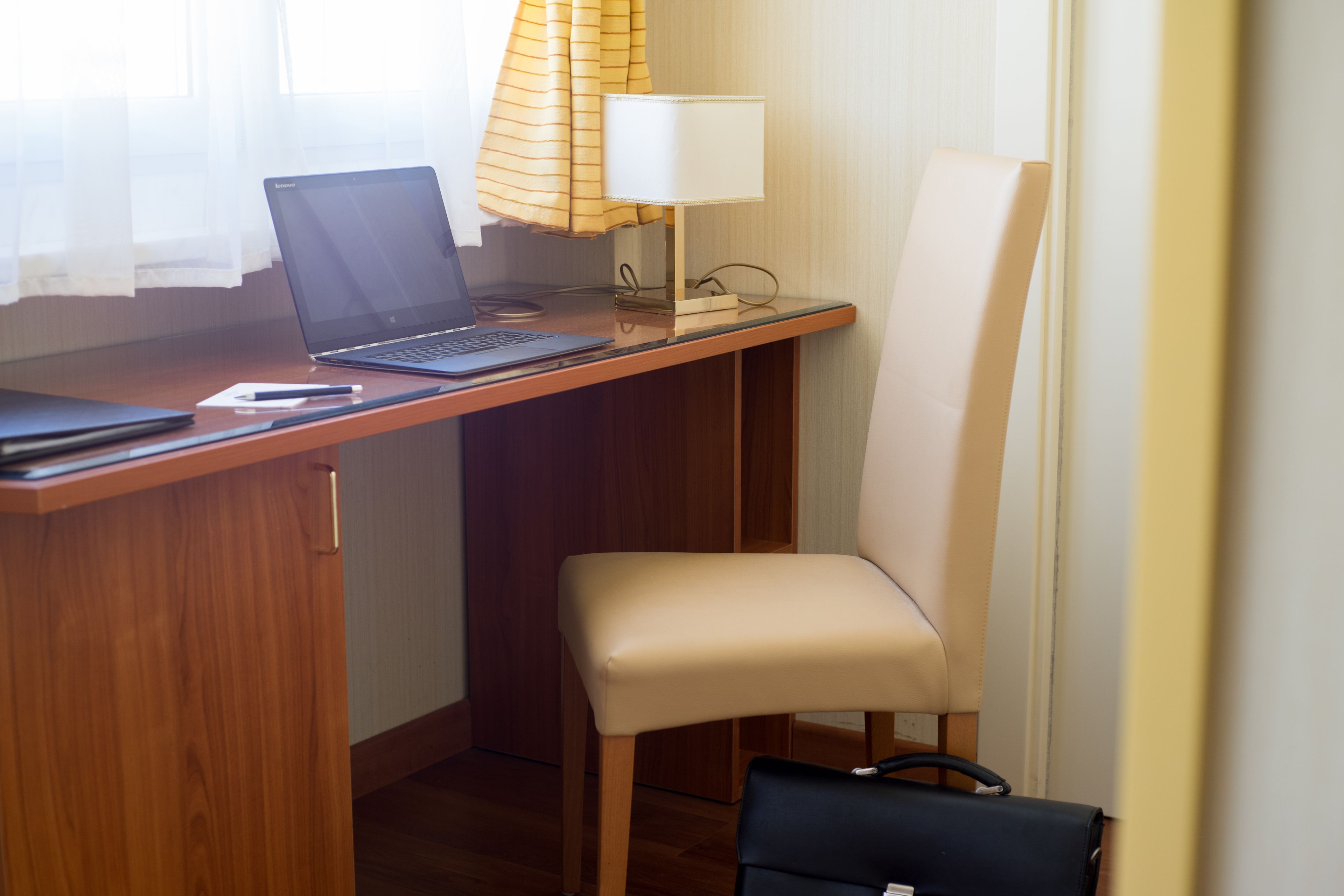 superior triple room, courtyard view | in-room business centre