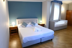Quadruple Room | Down comforters, minibar, desk, laptop workspace