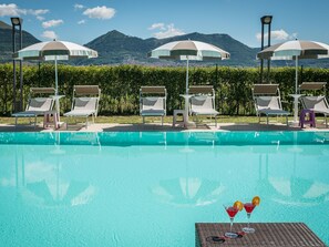 Seasonal outdoor pool, pool umbrellas, pool loungers