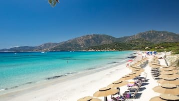 Private beach, white sand, sun-loungers, beach umbrellas