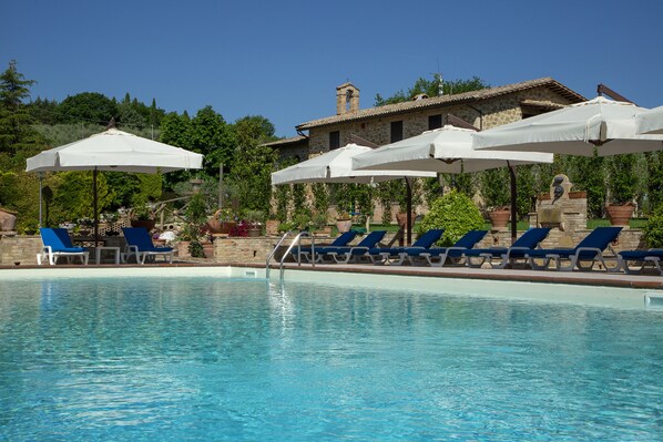 Seasonal outdoor pool, pool umbrellas, pool loungers