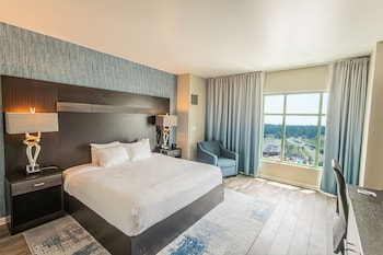 Premier Room, 1 King Bed | Desk, blackout drapes, iron/ironing board, cribs/infant beds at Hollywood Casino Gulf Coast