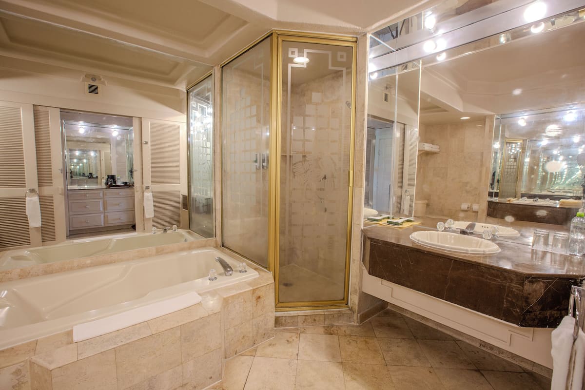 Separate tub and shower, rainfall showerhead, eco-friendly toiletries