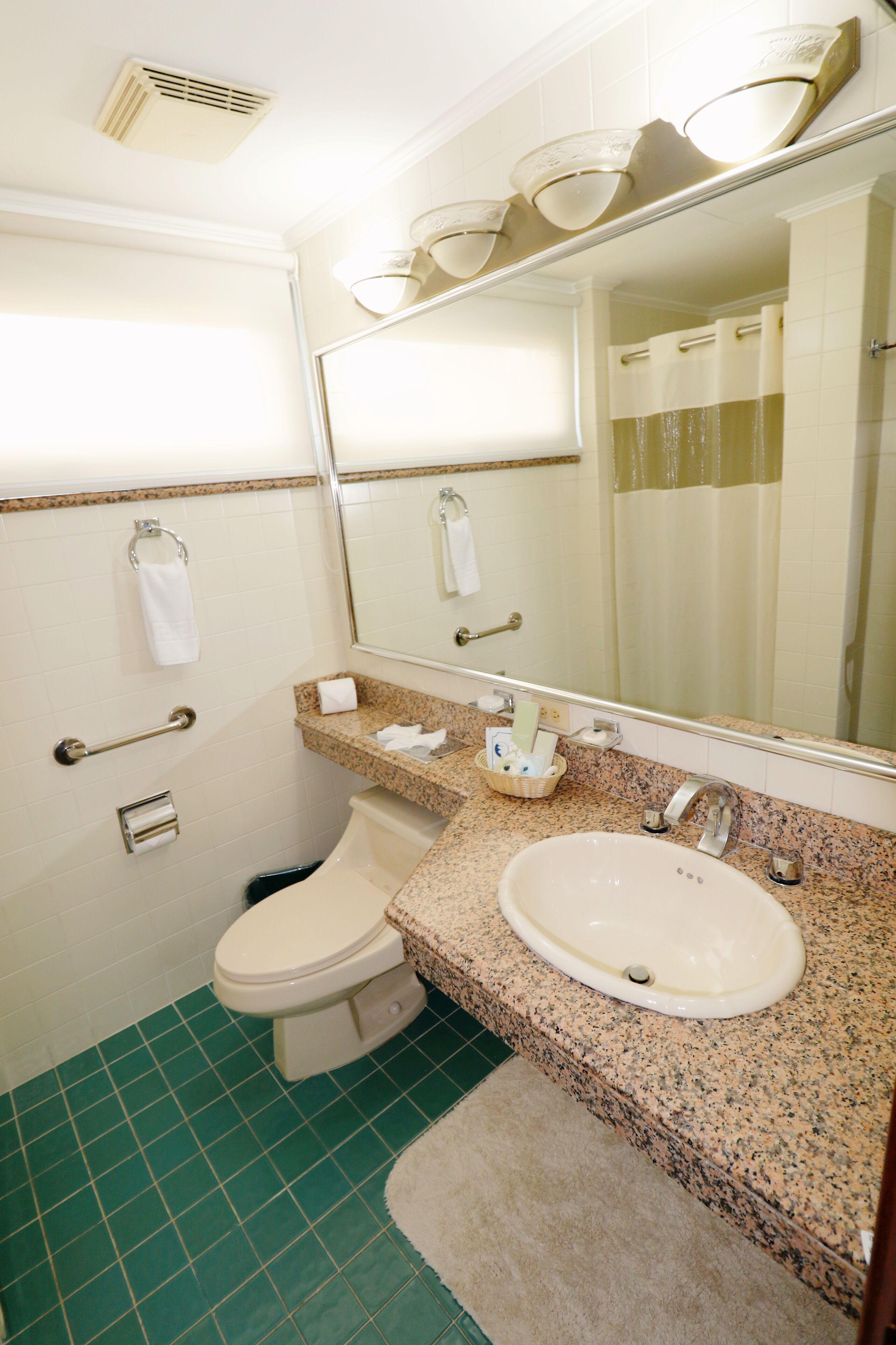junior suite | bathroom | shower, hair dryer, towels
