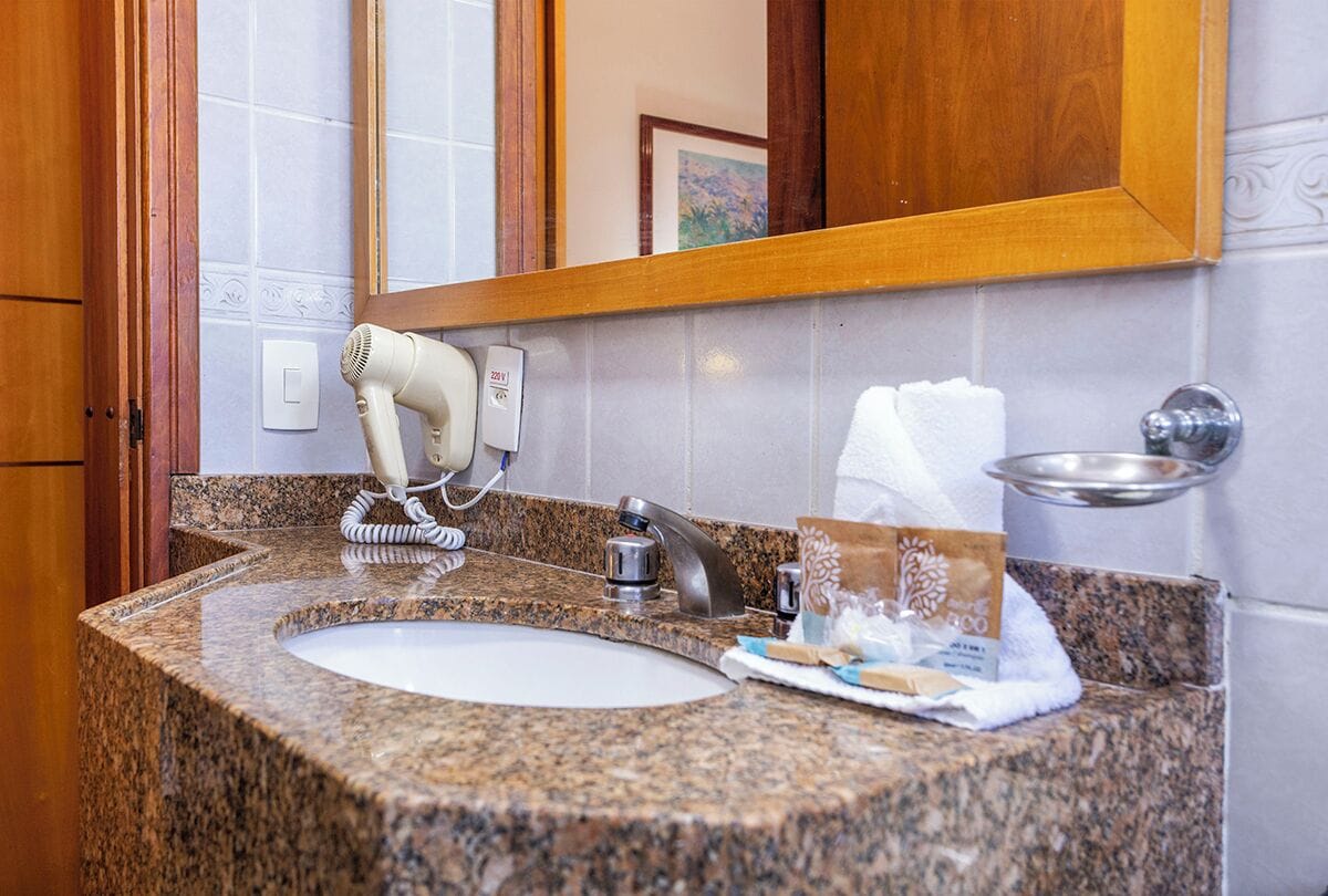 standard double room | bathroom | shower, eco-friendly toiletries, hair dryer, towels