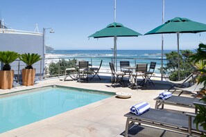 Outdoor pool, pool umbrellas, pool loungers