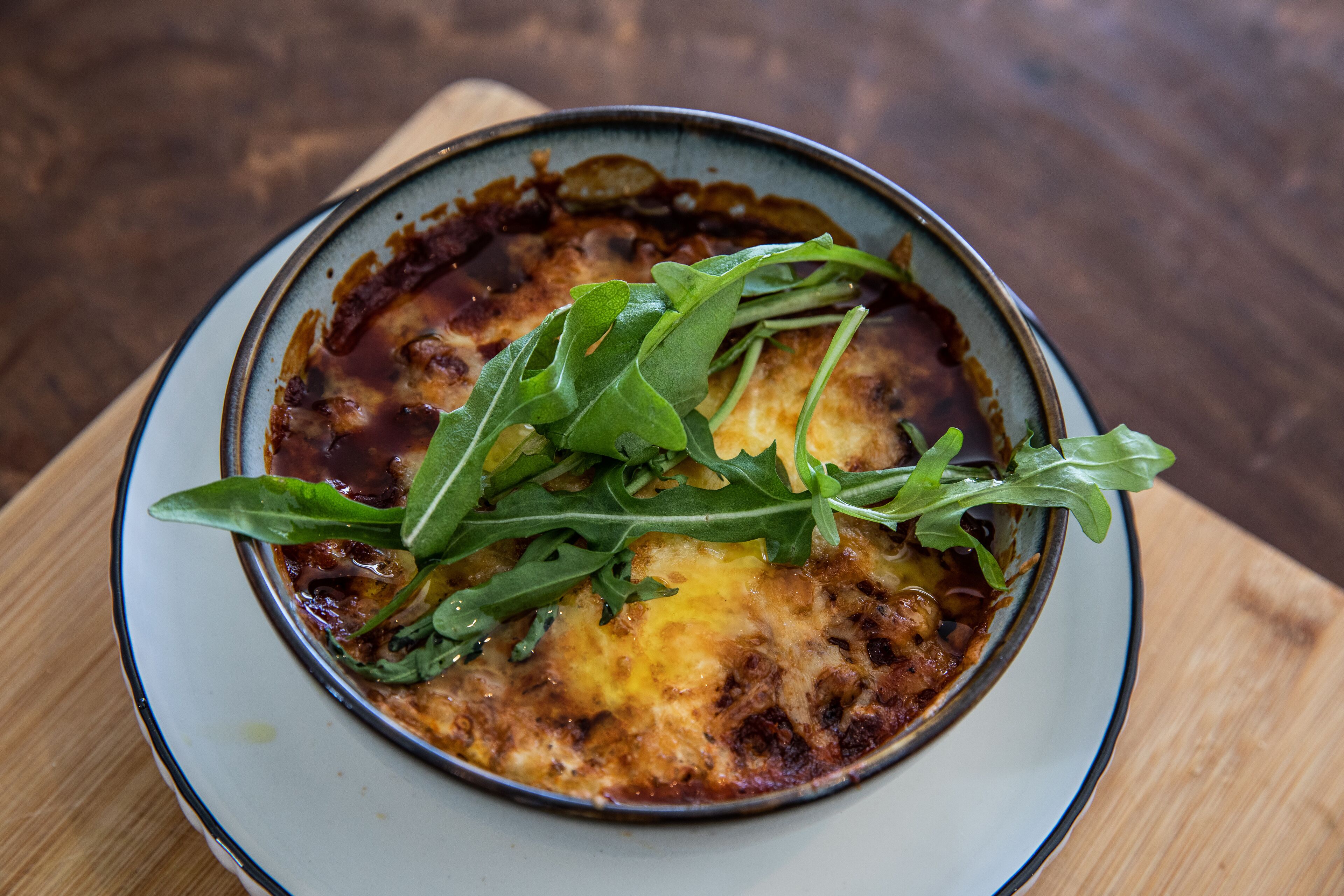 A dish with greens on a plate.