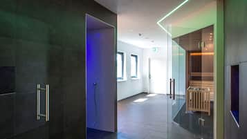 Welcome to a sleek and inviting reception area with a glass partition, wooden bench, and handrail for added safety.