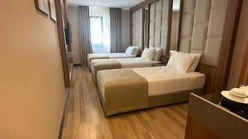 Chambre Triple | Minibar, coffres-forts dans les chambres, chambres insonorisées