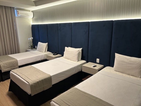 Deluxe Triple Room | 1 bedroom, minibar, in-room safe, desk