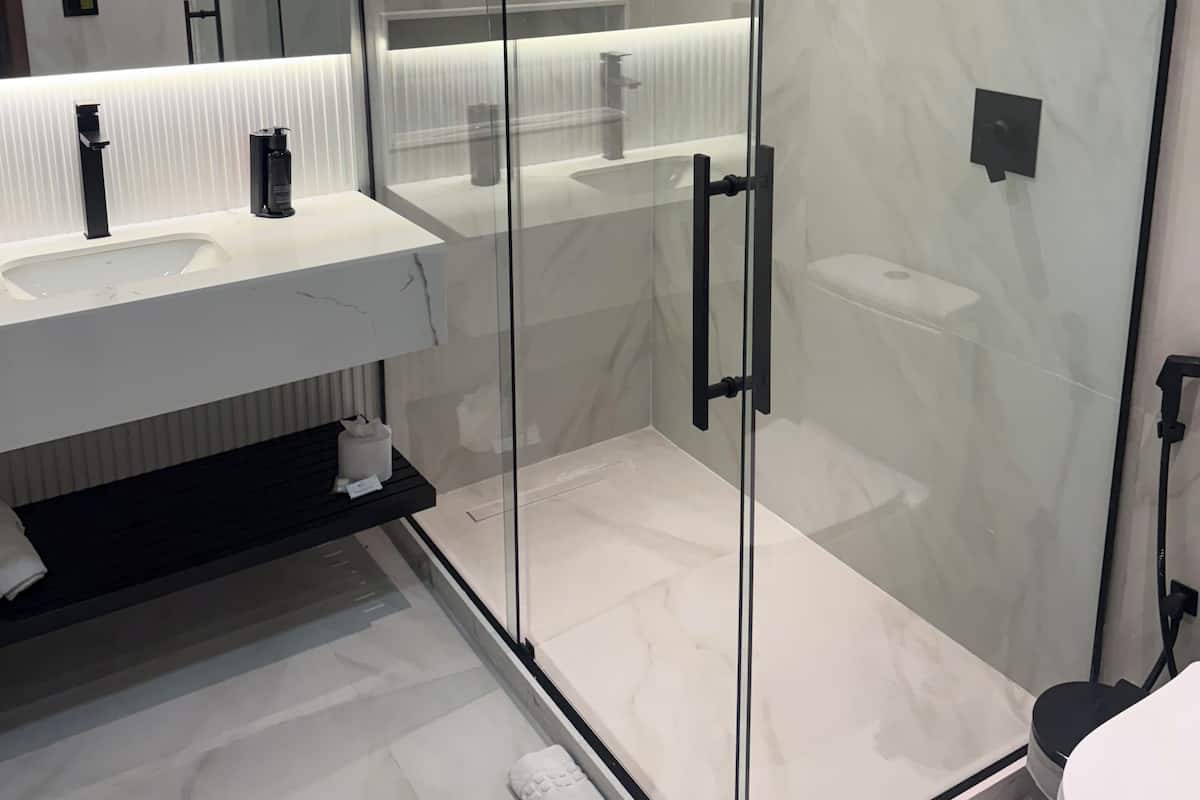 Shower, hair dryer, towels, soap